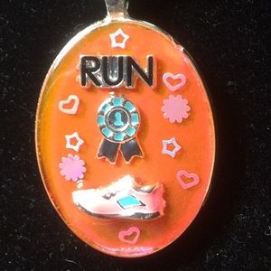 2 inches oval Run orangy 3 D resin pendant